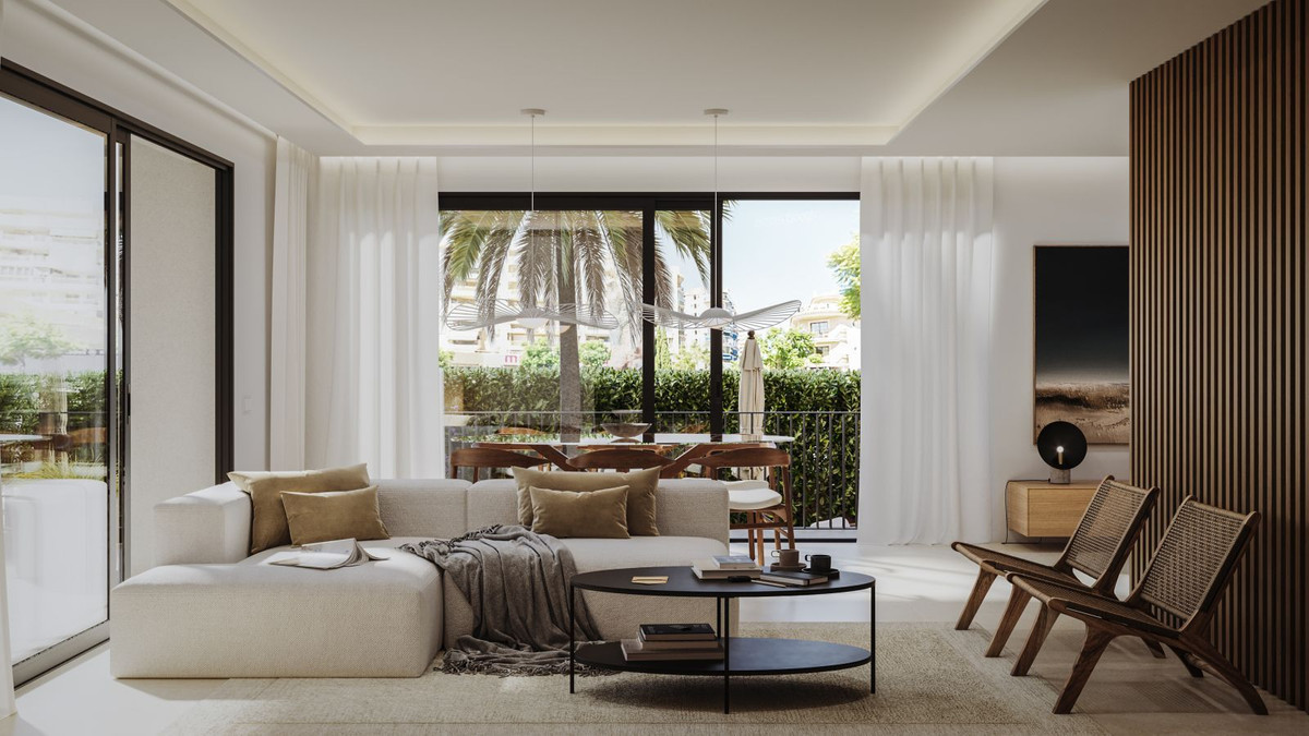 Modern living room with large windows, outdoor view, and minimalist furniture.